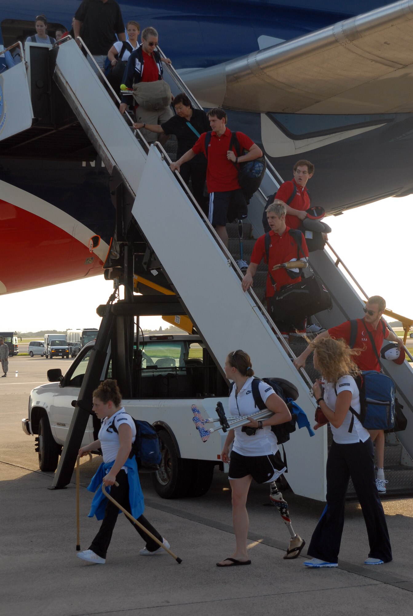 U.S. Paralympic athletes depart their aircraft and head to waiting
transportation on Kadena's flightline Aug. 24.  The athletes will spend the
week on base in preparation for the 2008 Beijing Paralympics. (U.S. Air
Force photo/Staff Sgt. Christopher Marasky)
