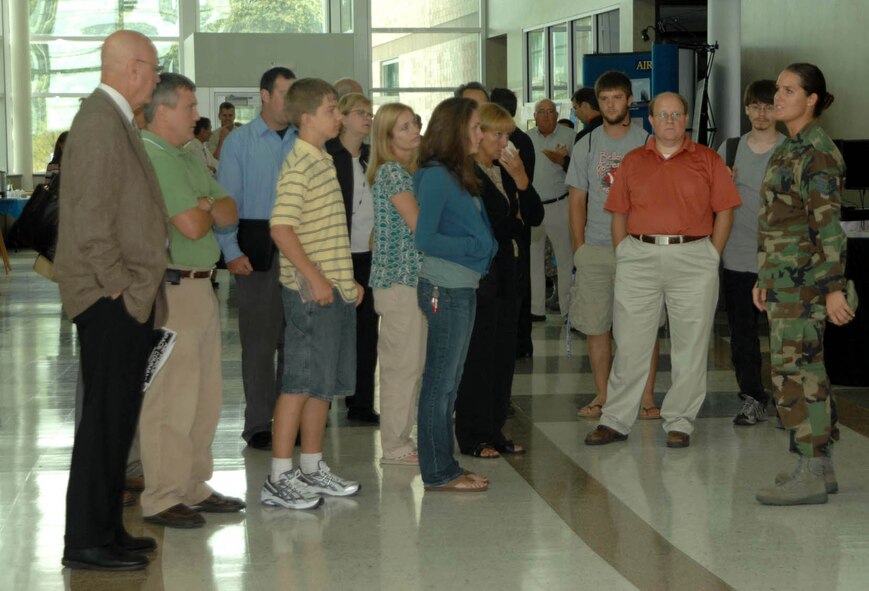 OFFUTT AIR FORCE BASE, Neb. – Staff Sgt. Janet Robinson, Air Force Weather Agency, gives a tour of the new AFWA headquarters building to attendees of the “The Air Force Goes Green and Clean” environmental symposium held here Aug. 14. The new headquarters building is a green rated facility designated by the U.S. Green Building Council. (Photo by Kendra Williams)