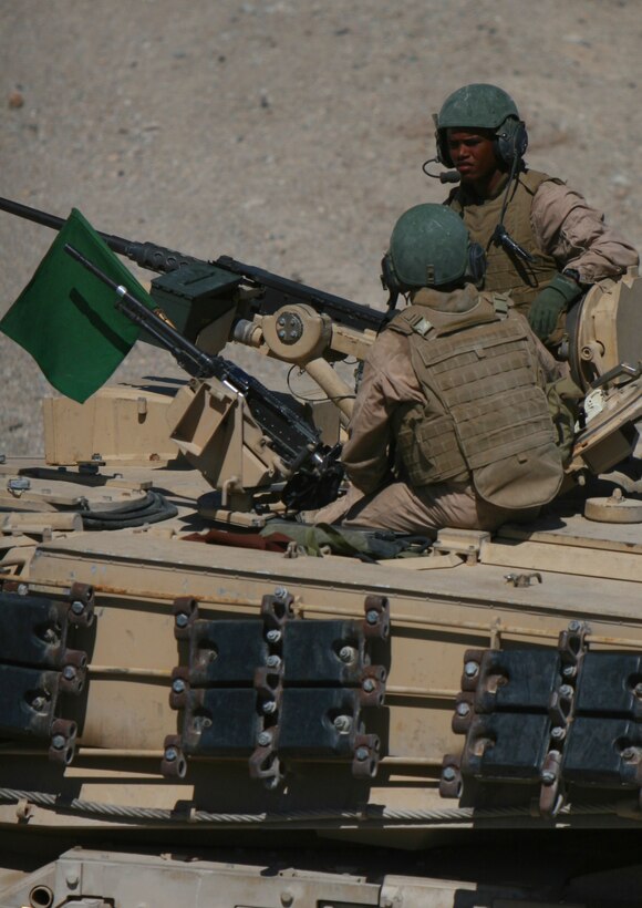 Marines from 1st Tank Battalion’s Company C, prepare their M1A1 Main Battle Tank from to engage targets using their M240G Medium Machine Gun, M2 .50 caliber Machine Gun and main tank gun during the battalion’s bi-annual gunnery qualification at Range 500 Aug. 26. The Marines have been off of their tanks for more than a year after deploying to Iraq with a provisional mission of providing Main Supply Route security.