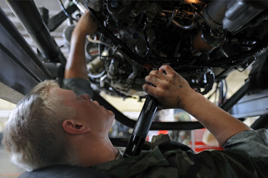 Airman First Class Zachary Darr, 28th Maintenance Squadron Aerospace Propulsion Apprentice, inspects a B-1B Lancer's General Electric F101 turbofan engine Aug. 26, 2008. Airmen thoroughly inspect for bad safety wires, cracks, loose bolts and any damage to the engine. (U.S. Air Force photo by Airman Corey Hook)