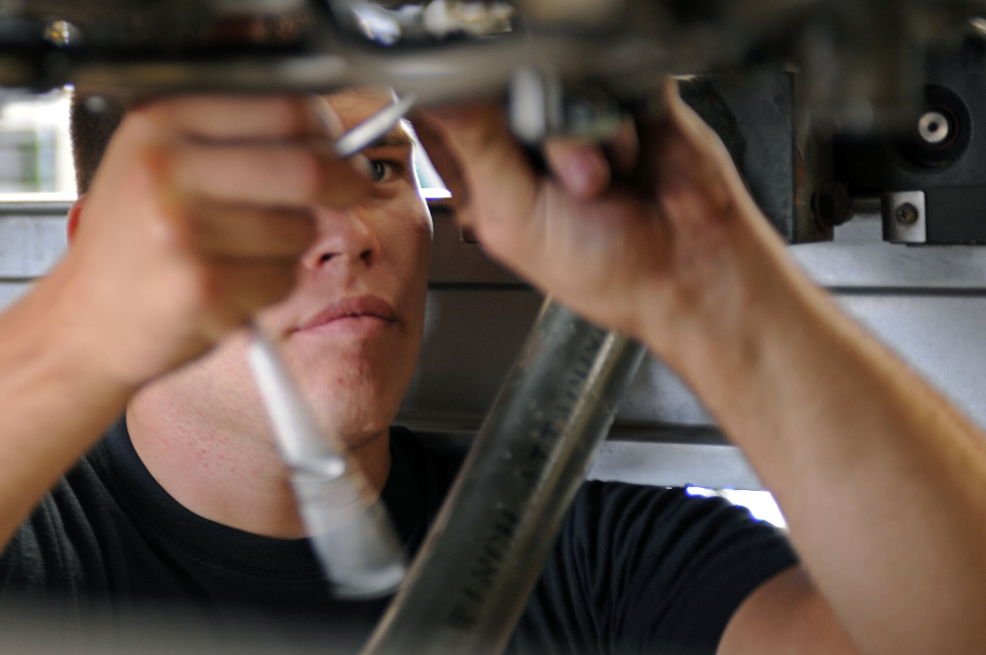 Airman First Class Kelly Lanton, 28th Maintenance Squadron Aerospace Propulsion Apprentice, tightens a bolt on a B-1B Lancer's General Electric F101 turbofan engine Aug. 26, 2008. Routine inspections are conducted regularly on all engines to ensure both readiness and aircraft safety. (U.S. Air Force photo by Airman Corey Hook)
