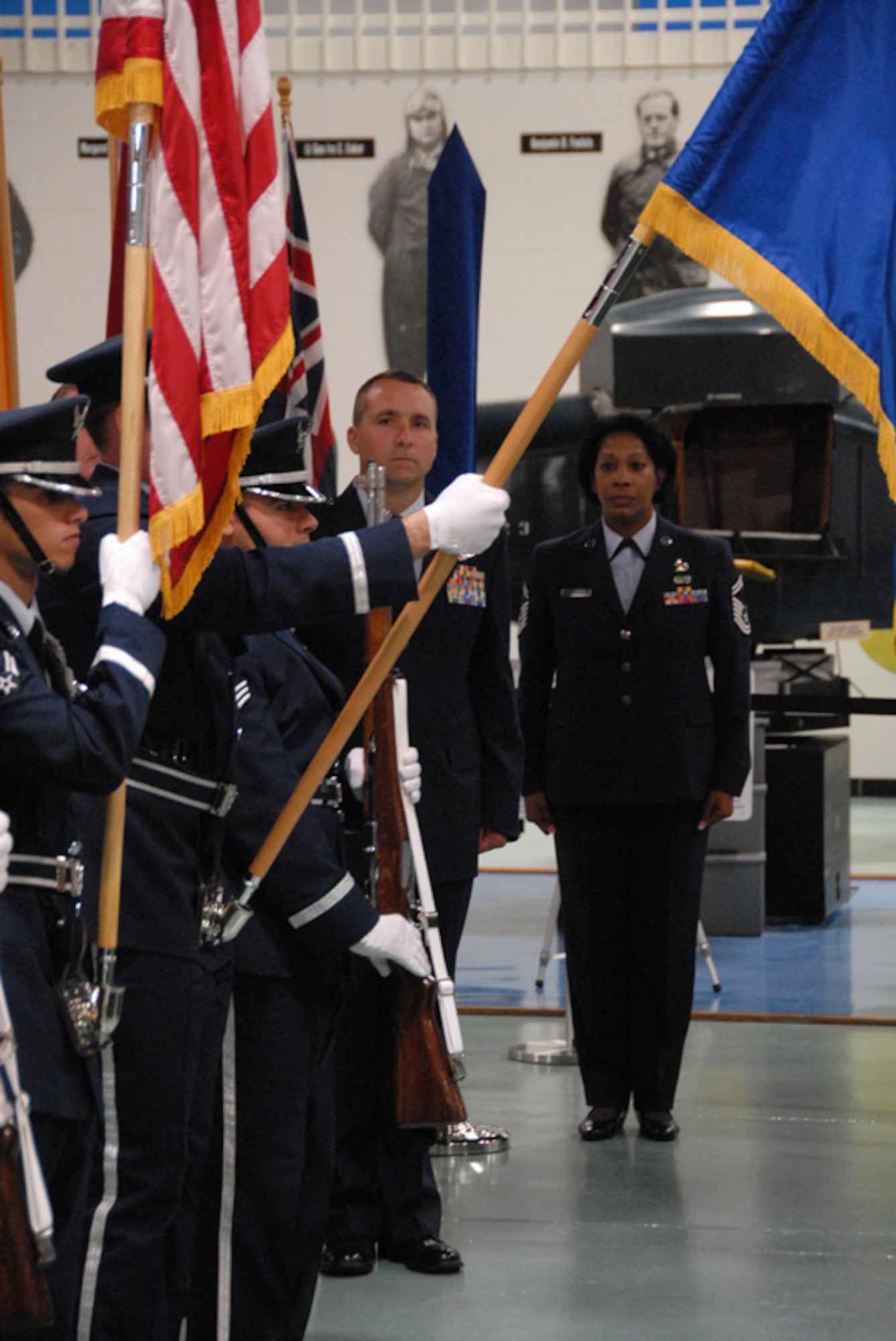 Lt. Col. John Breazeale and Senior Master Sgt. Sybil McDowell watch as the colors are presented by the Eglin Air Force Base honor guard during the 84th Test and Evaluation Squadron activation ceremony Aug 26 at the Air Armament Museum.  Colonel Breazeale is the new commander and Sergeant McDowell is the superintendent.  The 84 TES is the newest and only reserve squadron in the 53d Wing.  The squadron members fill regular Air Force positions within the wing's various units but report back to their reserve unit.  The squadron plans to have 18 members by year's end and 56 by 2012.  Photo by Staff Sgt. Samuel King Jr.