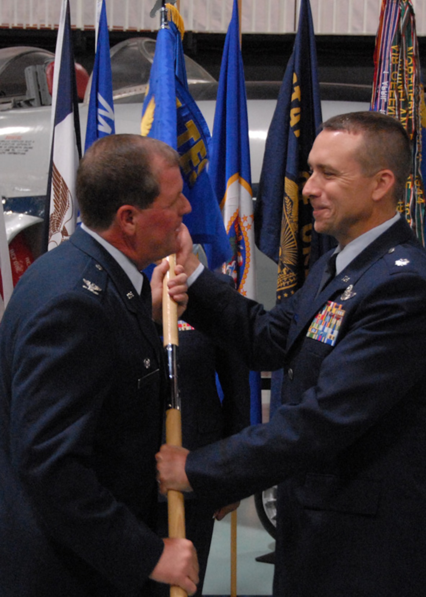 Col. David Culbertson, 926th Group, passes on some personal words before handing over the guidon to new commander, Lt. Col. John Breazeale at the 84th Test and Evaluation Squadron activation ceremony Aug 26 at the Air Armament Museum.   The 84 TES is the newest and only reserve squadron in the 53d Wing.  The squadron members fill regular Air Force positions within the wing's various units but report back to their reserve unit.  The squadron is scheduled to have 18 members by year's end and 56 by 2012.  Photo by Staff Sgt. Samuel King Jr.