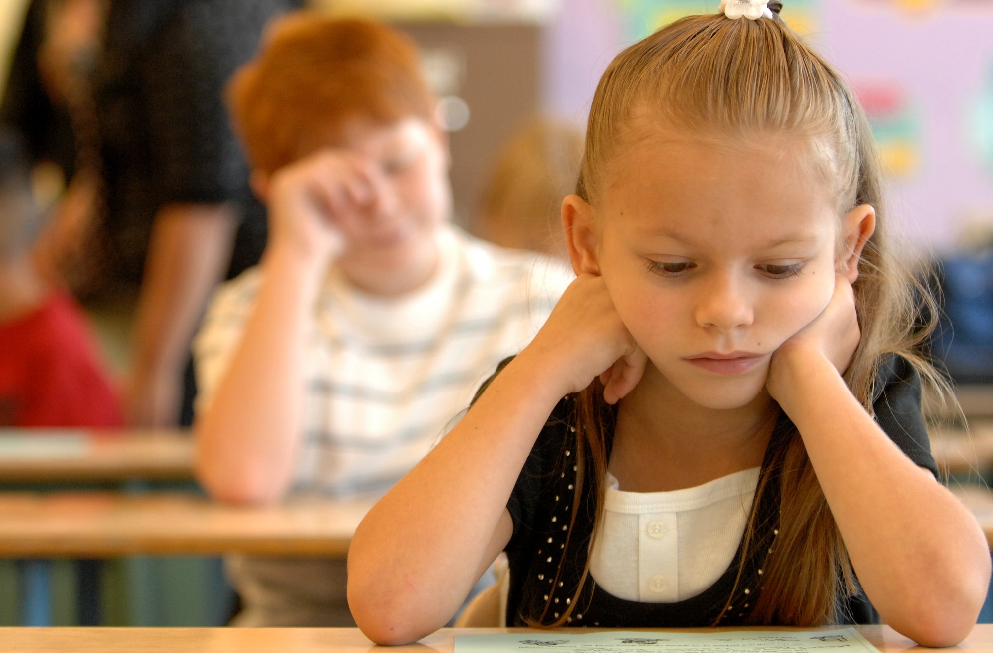 MOUNTAIN HOME AIR FORCE BASE, Idaho -- Alyssa Ziruolo looks over her class’ material list during her first day of third grade class Aug. 25. Today is the first day of school for the children attending the Base Primary School. (U.S. Air Force photo/ Airman 1st Class Stephany Miller)