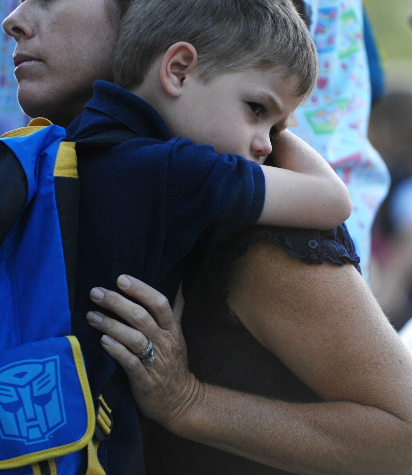 MOUNTAIN HOME AIR FORCE BASE, Idaho - Marcus Breed hugs his mother before going inside to start his first day of kindergarten class Aug. 25. Today is the first day of school for the children attending the Base Primary School at Mountain Home Air Force Base. (U.S. Air Force photo Airman 1st Class Stephany Miller)