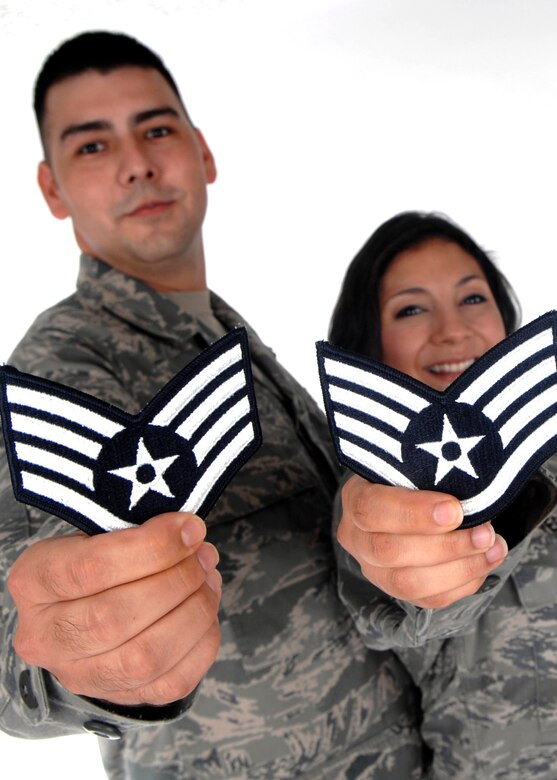 Senior Airmen John and Sonia Vega show off their new staff sergeant stripes after the promotion results were released Aug. 20.  The Senior Airmen Vegas were high school sweet hearts whohave been married for more than four years and have two sons. (U.S. Air Force photo by Airman 1st Class Joanna M. Kresge) 