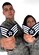 Senior Airmen John and Sonia Vega show off their new staff sergeant stripes after the promotion results were released Aug. 20.  The Senior Airmen Vegas were high school sweet hearts whohave been married for more than four years and have two sons. (U.S. Air Force photo by Airman 1st Class Joanna M. Kresge) 