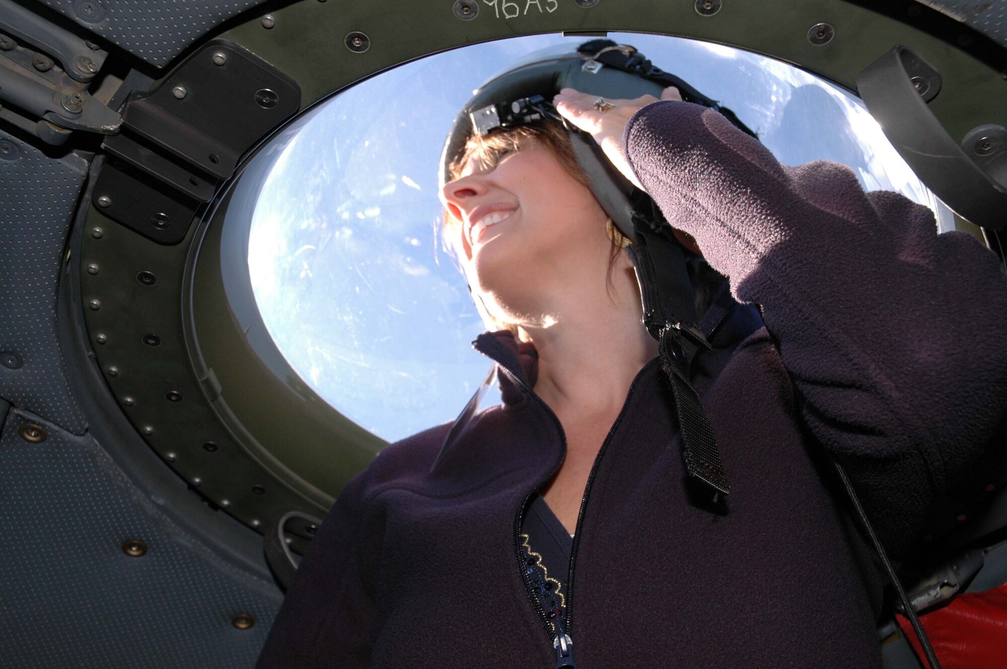Holly Andreasen gets a 360 degree view of the world from the cockpit bubble in the C-130 as part of the 934th Airlift Wing Employers Day. Employers of reservists had the chance to get a close up look at the 934th and learn about the job their employees do in the Air Force Reserve. (Air Force Photo/Master Sgt. Kerry Bartlett)