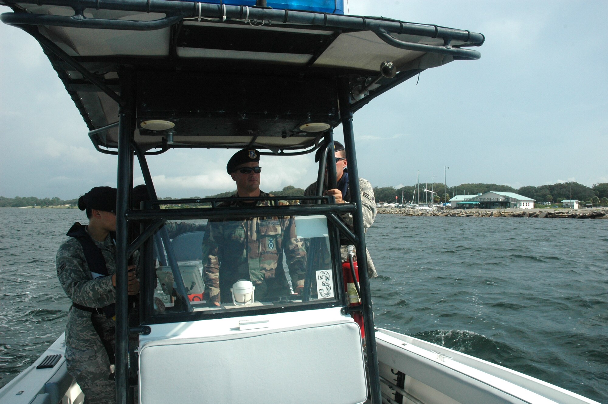 Tech. Sgt. Allen Merritt, 325th Security Forces Squadron community services trainer, teaches a patrol-boat certification class to three of the community police center patrolmen here today.  (U.S. Air Force photo/Staff Sgt. Timothy R. Capling)