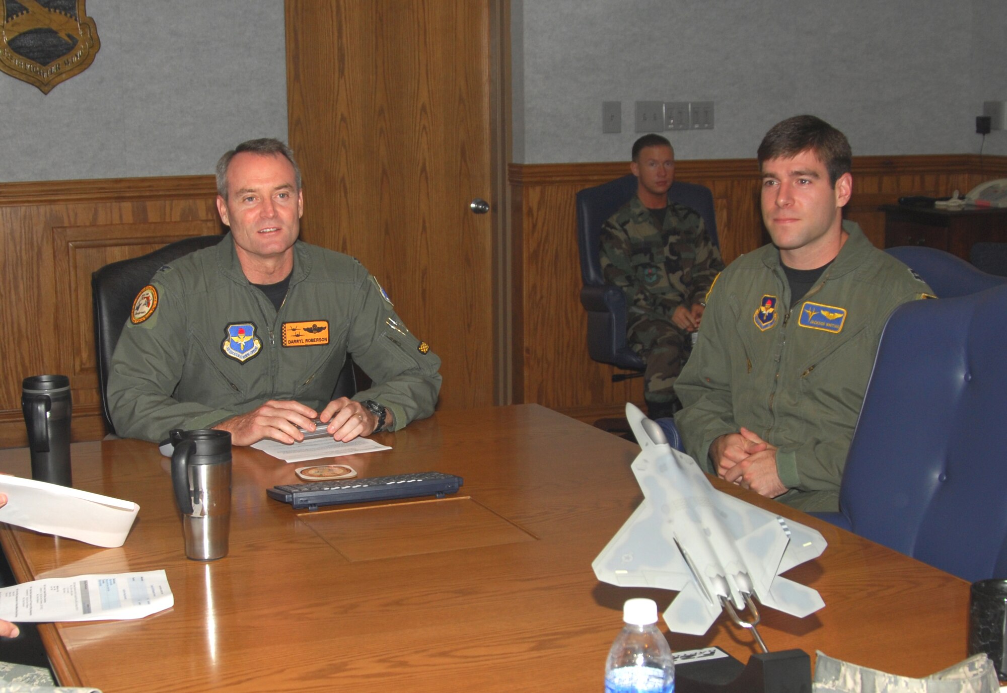 Captain Jackson Whiting, 95th Fighter Squadron flight commander and F-15 instructor pilot, shadows Col. Darryl Roberson, 325th Fighter Wing commander, during the commander’s staff meeting here today.  Captain Whiting was one of two 325th FW pilots who trained an entire F-15 squadron while deployed to Saudi Arabia.  He was also the lead point of contact for the “Pilot for a Day” program, which provides Tyndall Air Force Base tours for physically challenged youths.  Captain Whiting spent the day with Colonel Roberson as part of the Commander’s Shadow Program.  He has served eight years in the military and is a native of Columbus, S.C.  (U.S. Air Force photo by Lisa Norman)
