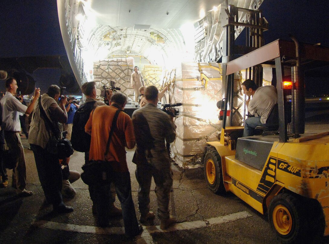 International press photograph the first of 16 pallets containing $1 million in U.S.-donated medical supplies, blankets, sleeping bags and bed sheets for the people of the Republic of Georgia on a C-17 Globemaster III Aug. 13 at Sembach Air Base, Germany. The delivery was a joint service effort between Airmen representing both U.S. Air Forces in Europe and Air Mobility Command, as well as U.S. Army Europe Soldiers. (U.S. Air Force photo/Master Sgt. Scott Wagers) 