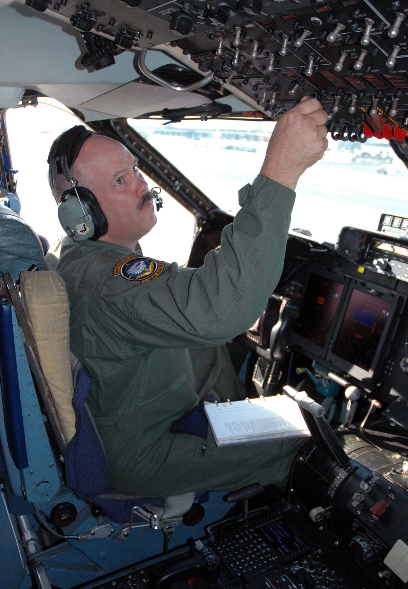 Chief Master Sgt. Donald Cunningham performs a preflight check on a C-5 Galaxy from Westover Air Reserve Base, Mass., that received a modernized glass cockpit and avionics upgrade through the Avionics Modernization Program. Airmen from Dover Air Force Base, Del., and Travis AFB, Calif., are overseeing the Avionics Modernization Program modifications of all the Air Force Reserve Command C-5s and will manage the rest of the C-5 fleet's conversion through 2015. Chief Cunningham is the 512th Acceptance Check Flight superintendent. (U.S. Air Force photo/Capt. Marnee A.C. Losurdo)