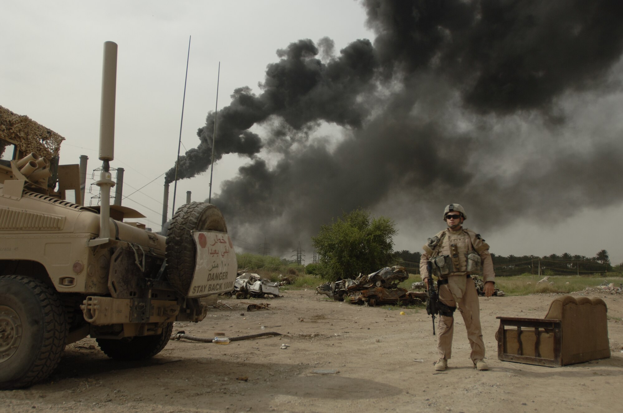 In this undated photo, Staff Sgt. Christopher Seligman provides a show of force near a Baghdad police station two weeks after suicide truck bombers had attacked it. Sergeant Seligman was awarded the Air Force Combat Action Medal for his actions under fire in support of Operation Iraqi Freedom. (Courtesy photo)