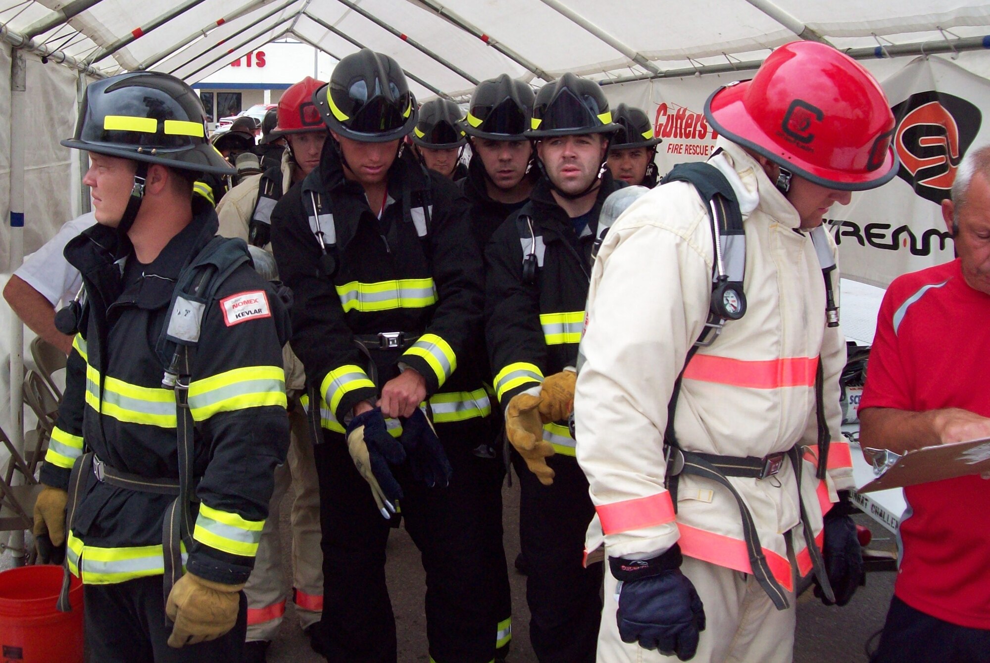 Members of the Peterson Fire Department’s Firefighter Combat Challenge Team – from left to right, Senior Airman John Dannen, Staff Sgts. Joel Hammond, Nick Hall and Jimmy Welch, and Senior Airman Chris Ingle -  prepare to compete Aug. 16 in Altus, Okla. Peterson’s Fire Department competed at the regional event, earning ninth place out of 20 competitors. Their time of 1 minute and 33 seconds qualified them for the World Challenge Nov. 11 in Las Vegas. (Courtesy photo)
