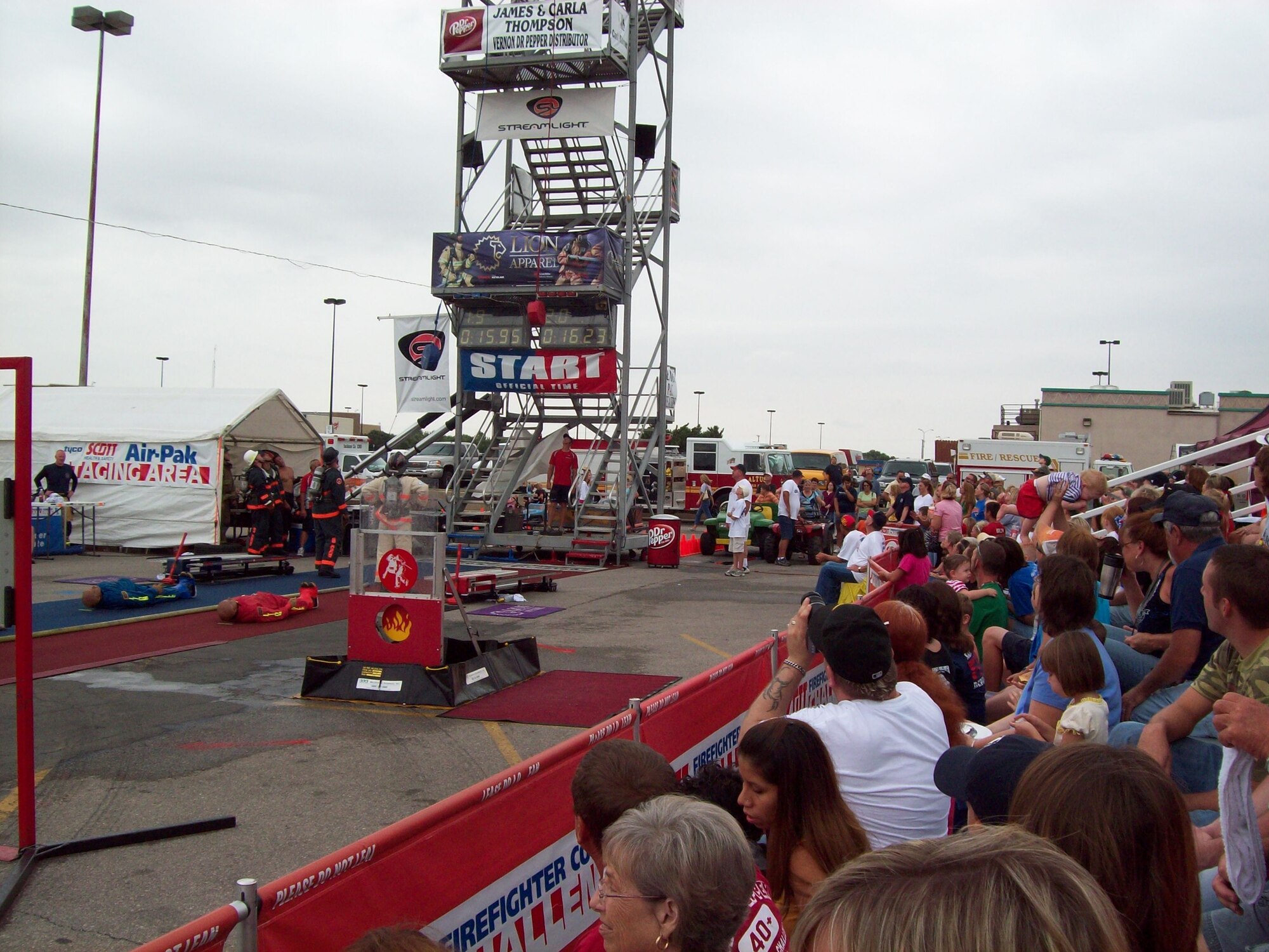 Spectators watch teams prepare to tackle the Firefighter Combat Challenge course Aug. 16 in Altus, Okla. Members of Peterson’s Fire Department competed at the regional event, earning ninth place out of 20 competitors. Their time of 1 minute and 33 seconds qualified them for the World Challenge Nov. 11 in Las Vegas. (Courtesy photo)