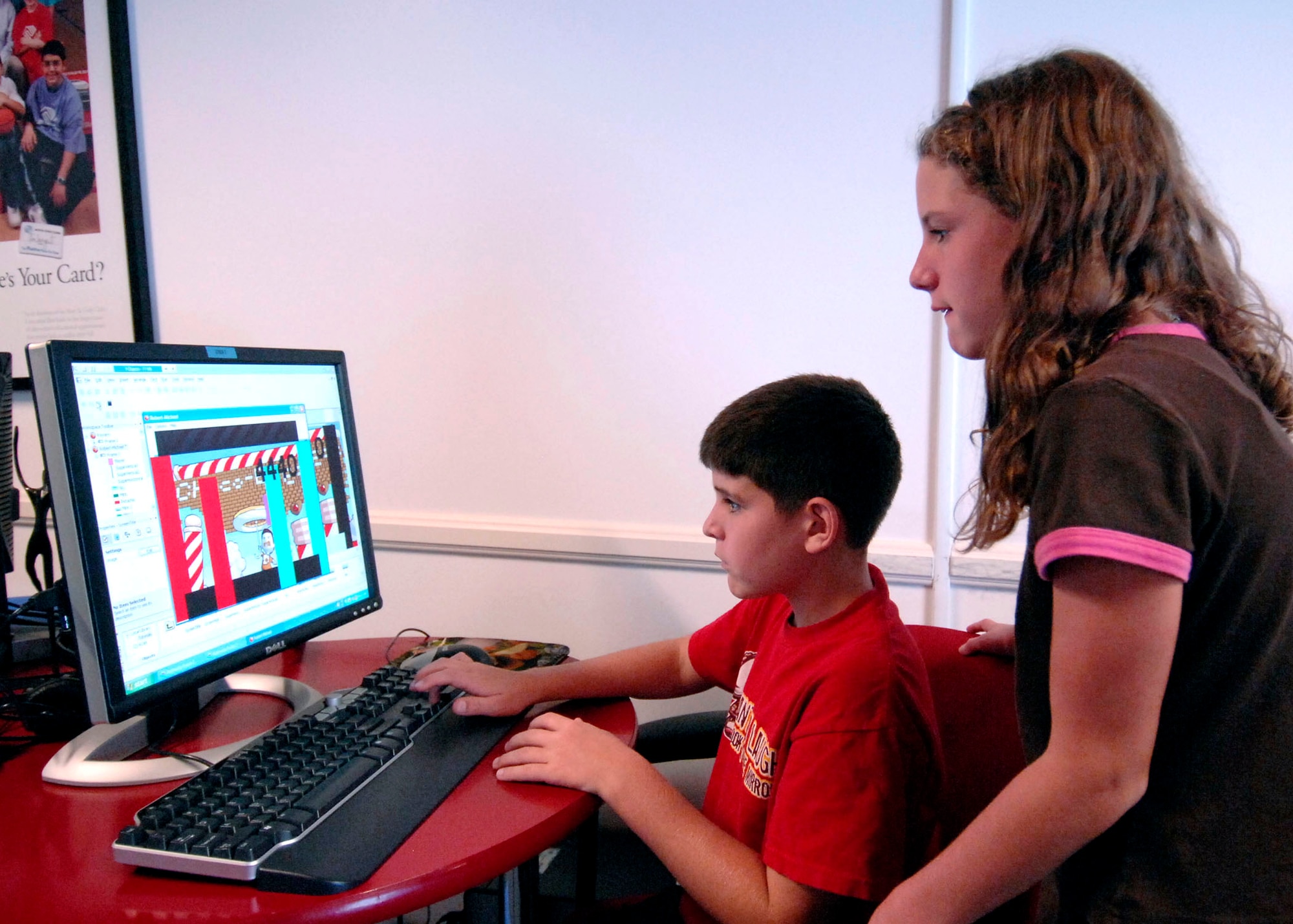 Robert-Michael and his sister Ryann Midkiff are learning to manipulate and construct a computer game as part of the Youth Summer Camp, Technology Week at Fort Mac Arthur Youth Center Aug. 18-22.  Their dad is Master Sgt. Stephen Midkiff, 61st Civil Engineering Logistics Squadron. (Photo by Lou Hernandez)

