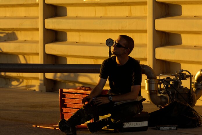 Airman First Class Elijah Dames, crew chief, 13th Fighter Squadron, Misawa Air Base, Japan, reviews F-16 technical orders August 21, 2008, during exercise Green Flag 080-9 at Nellis Air Force Base, Nev. This training prepares U.S. forces to fight in a high-tech combat environment while providing Air Force leaders valuable planning experience.  Green Flag exercises use state-of-the-art technology to provide world class close air support counter land airpower training for Air Force, sister services, and international combat fighter, bomber, and airborne command and control squadrons stressing realistic combat environments focused on high desert armored warfare.  The exercise facilitates joint operational training at the U.S. Army National Training Center at Fort Irwin, Calif.  Green Flag also trains Air Force ground combat units in the tactical control of airpower in the close battle.  U.S. Army brigade commanders and their combat forces deployed to NTC receive the support and integrate the airpower.
(U.S. Air Force photo/ Master Sgt. Kevin J. Gruenwald) 