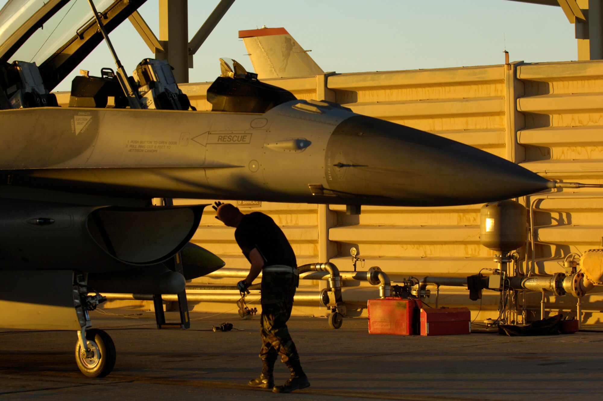 Airman First Class Rory Conway, crew chief, 13th Fighter Squadron, Misawa Air Base, Japan, conducts an F-16 post flight inspection August 21, 2008, during exercise Green Flag 080-9 at Nellis Air Force Base, Nev. This training prepares U.S. forces to fight in a high-tech combat environment while providing Air Force leaders valuable planning experience.  Green Flag exercises use state-of-the-art technology to provide world class close air support counter land airpower training for Air Force, sister services, and international combat fighter, bomber, and airborne command and control squadrons stressing realistic combat environments focused on high desert armored warfare.  The exercise facilitates joint operational training at the U.S. Army National Training Center at Fort Irwin, Calif.  Green Flag also trains Air Force ground combat units in the tactical control of airpower in the close battle.  U.S. Army brigade commanders and their combat forces deployed to NTC receive the support and integrate the airpower.
(U.S. Air Force photo/ Master Sgt. Kevin J. Gruenwald)