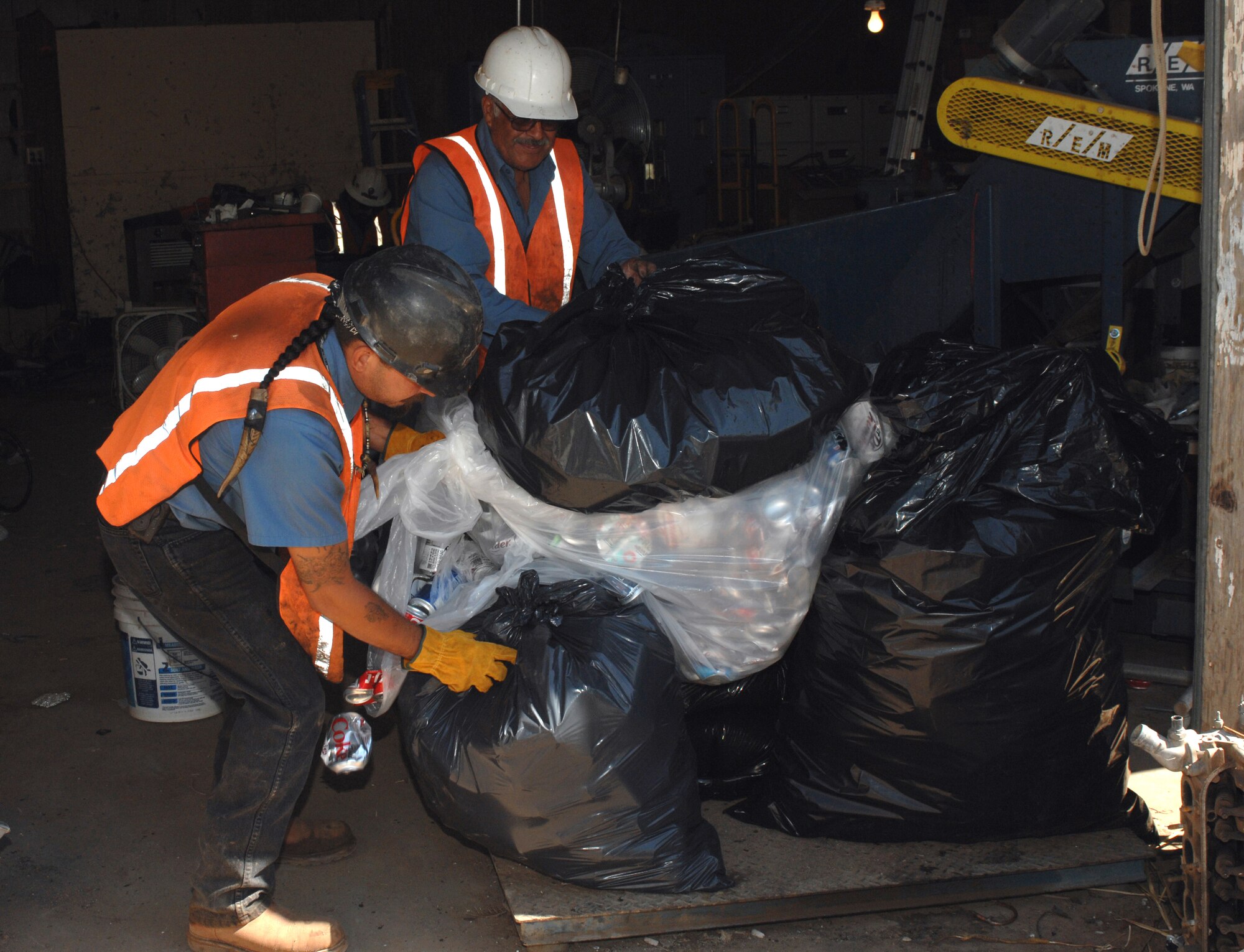 CANNON AIR FORCE BASE, N.M. - Workers at Ed's Recycling Center weigh in the amount of cans collected from Cannon's local Air Force Sergeant's Association, Chapter 55. The amount of cans collected was 103 pounds, worth $61.88, which was donated to Habitat for Humanity. (U.S. Air Force photo/Airman 1st Class Danielle Martin)