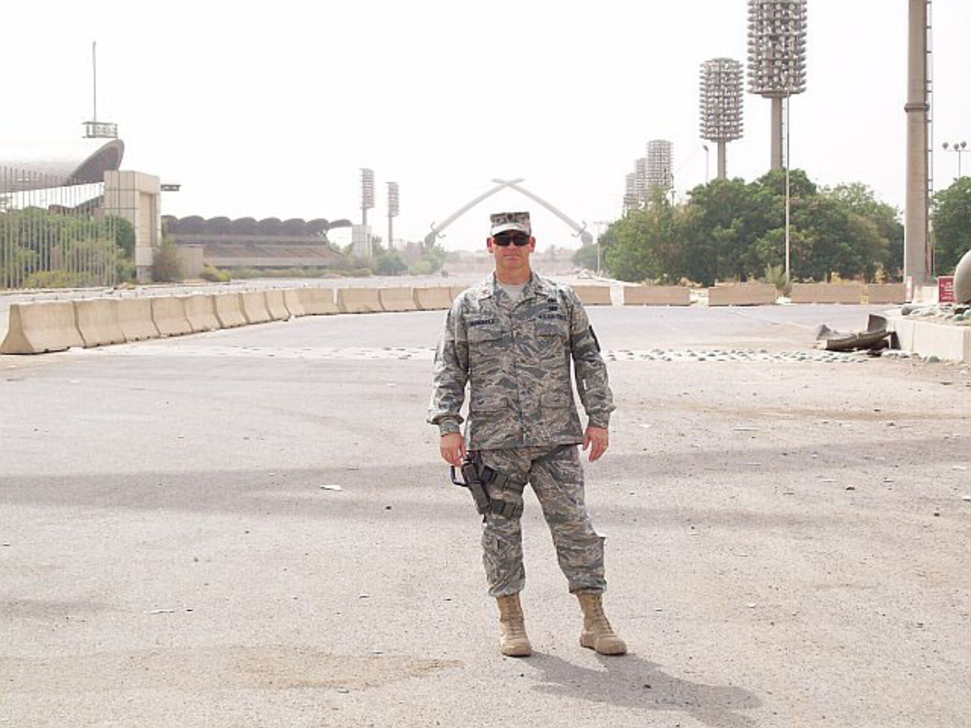 SEYMOUR JOHNSON AIR FORCE BASE, N.C. -- Maj. Drew McDannold, a Reservist with the 916th Maintenance Group, stands on the former Iraqi Parade Grounds outside of Phoenix Base in Iraq. Maj. McDannold is assigned to the Coalition Air Force Training Team, heading up the foreign military sales program which will help the Iraqi Air Force plan and organize their maintenance.