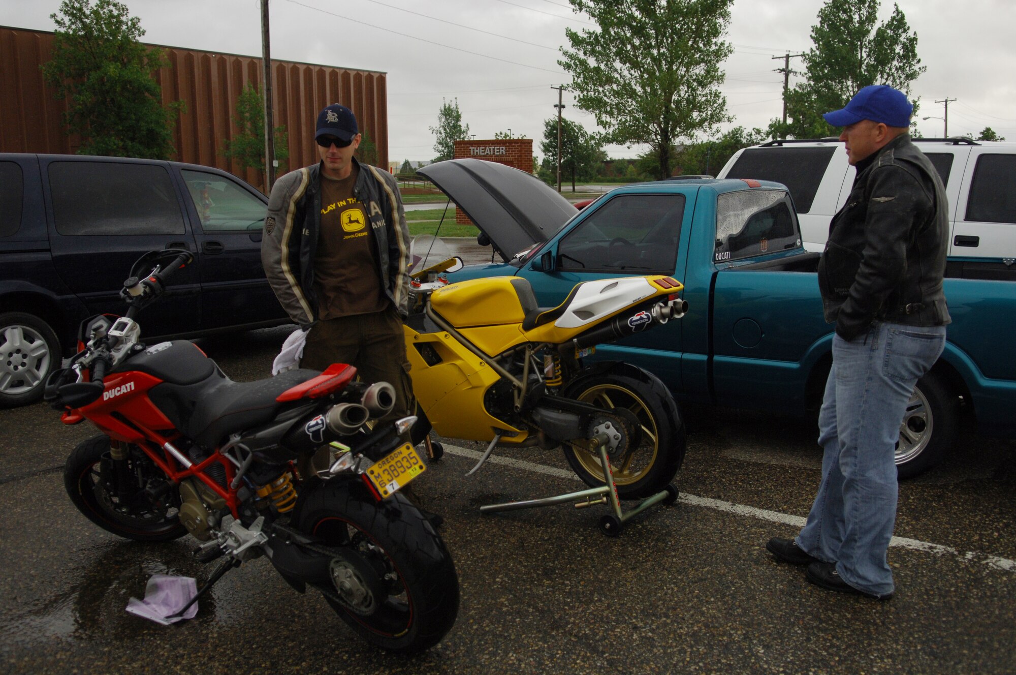 MINOT AIR FORCE BASE, N.D. – Staff Sgt. Sam Brandt, 5th Aircraft Maintenance Squadron unit training monitor, and 1st Lt. Brad Beckwith, 742nd Missile Squadron ICBM combat crew deputy commander, look at the motorcycles during the car show at J.R. Rockers here Aug. 22. Along with the motorcycles, there were 18 cars and trucks on display outside and raffles and a hula-hoop contest held inside. (U.S. Air Force photo by Senior Airman Cassandra Jones)