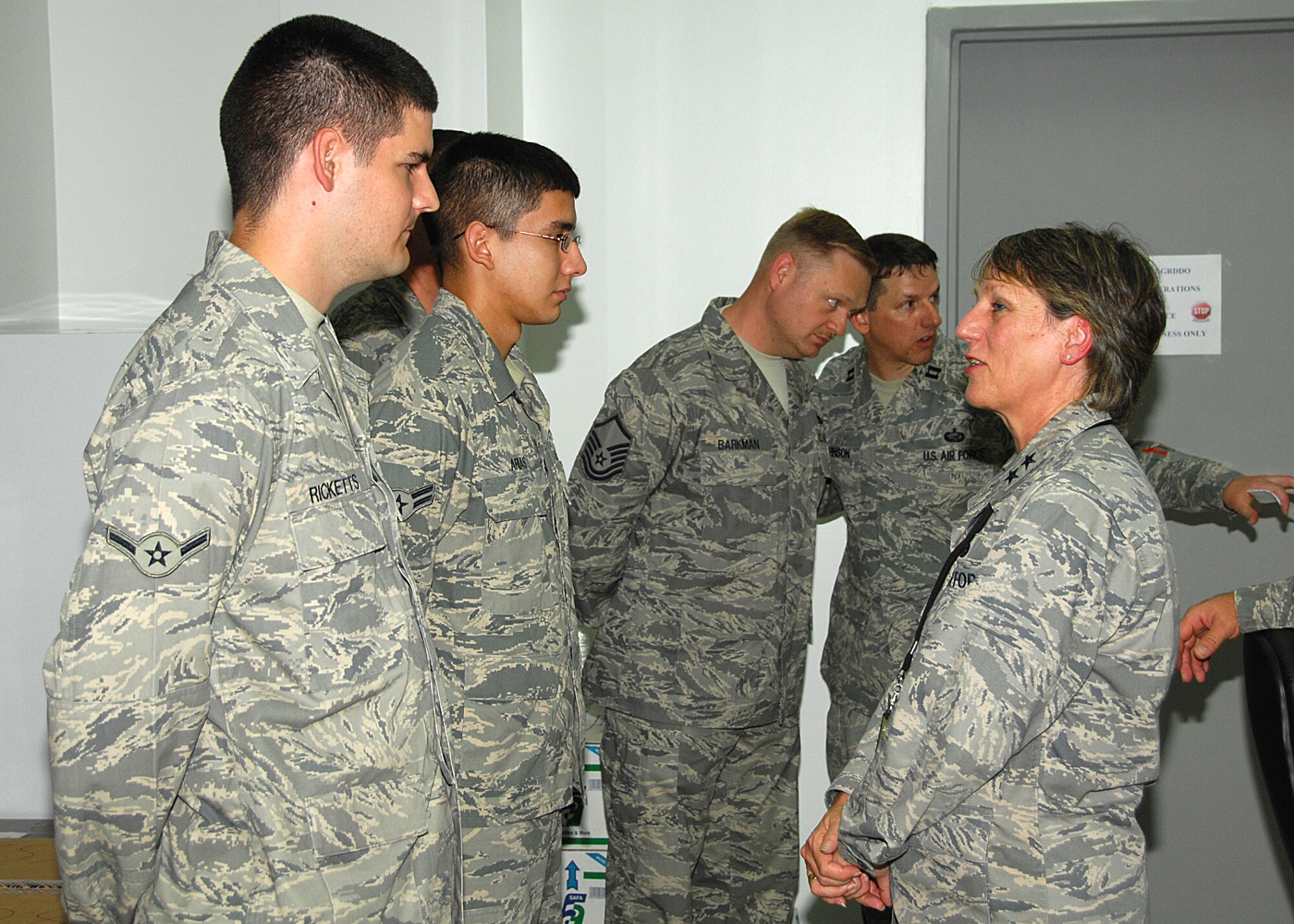SOUTHWEST ASIA -- Maj. Gen. K. C. McClain, commander of the Air Force Personnel Center at Randolph Air Force Base, Texas, visits with Airmen of the 386th Air Expeditionary Wing on Aug. 25 at an air base in Southwest Asia. During Gen. McClain’s visit, she toured the 386th Expeditionary Mission Support Group, Army Life Support Area, Deployment Control Center and the 586th Air Expeditionary Group at Camp Bucca, Iraq to get a firsthand feel of any personnel issues at bases in the U.S. Central Command area of responsibility. (U.S. Air Force photo/Tech. Sgt. Raheem Moore)  