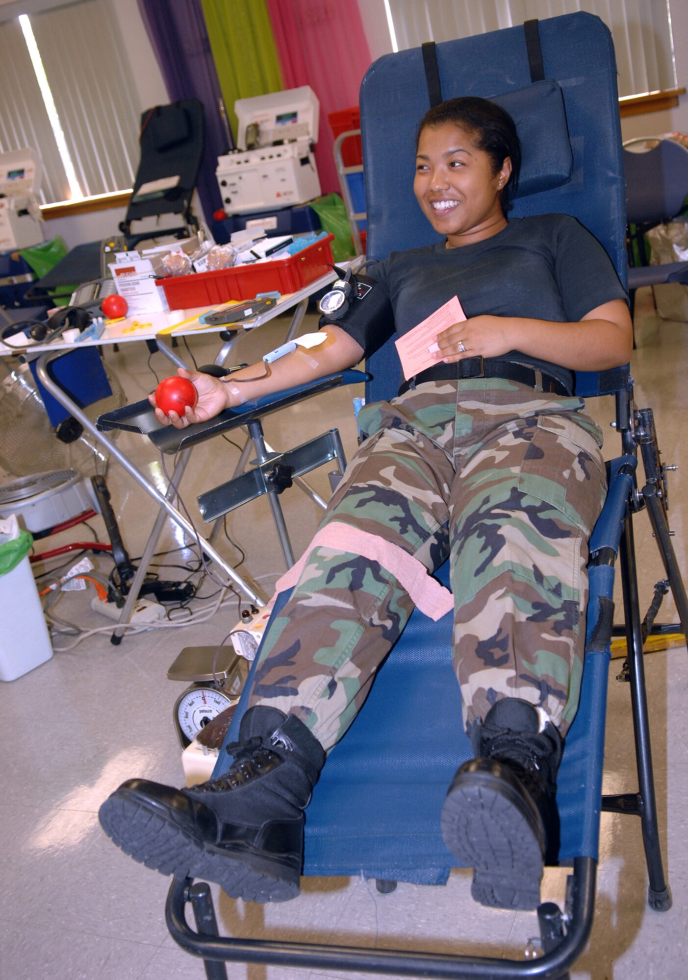 Airman 1st Class Shemeka Allen, a member of the 355th Comptroller Squadron, donates blood at the American Red Cross blood drive here Aug. 20. (U.S. Air Force photo by Airman 1st Class Jamie L. Coggan)
