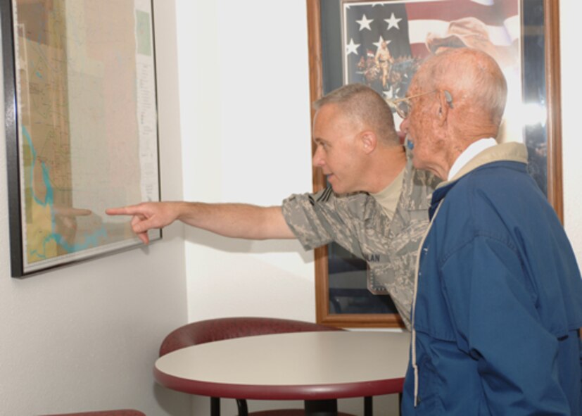 MINOT AIR FORCE BASE, N.D. -- Chief Master Sgt. Todd Kabalan, 8th Air Force Command Chief Master Sgt., shows retired Chief Master Sgt. of the Air Force James McCoy a map of the missile alert facilities during a tour of the Airman Leadership School here Aug. 22. While at Minot AFB CMSAF McCoy visited many workcenters and was also the guest speaker at the senior noncommissioned officer induction ceremony held Aug. 22. (U.S. Air Force photo by Senior Airman Sharida Jackson)