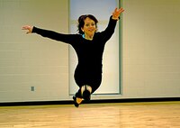 MINOT AIR FORCE BASE, N.D. -- 2nd Lt. Kidron Vestal, MAFB Public Affairs deputy chief, demonstrates a leap during a dance class held Aug. 21 at the McAdoo Sports and Fitness Center here. The lieutenant has been dancing for 10 years. (U.S. Air Force photo by Airman 1st Class Jesse Lopez)