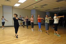 MINOT AIR FORCE BASE, N.D. -- A group of beginners learn the fundamentals of dance from 2nd Lt. Kidron Vestal, MAFB Public Affairs deputy chief, Aug. 21 at the McAdoo Sports and Fitness Center here. (U.S. Air Force photo by Airman 1st Class Jesse Lopez)