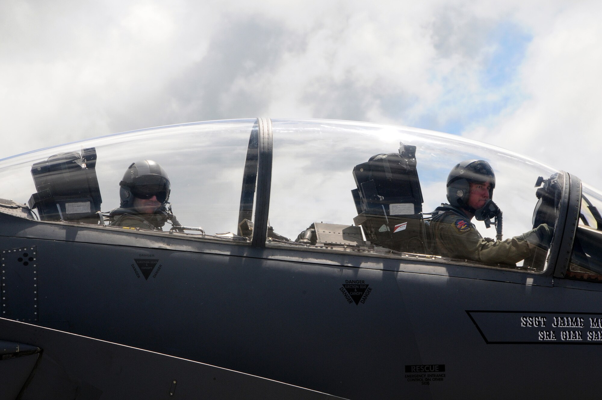 ANDERSEN AIR FORCE BASE, Guam - Brigadier Gen. Doug Owens, 36th Wing commander,and Major Christopher Eberle, 389th Fighter Squadron F-15E Strike Eagle pilot, make last-minute preparations before taking off on the general's final flight here Aug. 26. Under his command, the 36th WG has undergone many changes, including the incorporation of the Global Hawk mission here. (U.S. Air Force photo by Airman 1st Class Courtney Witt)