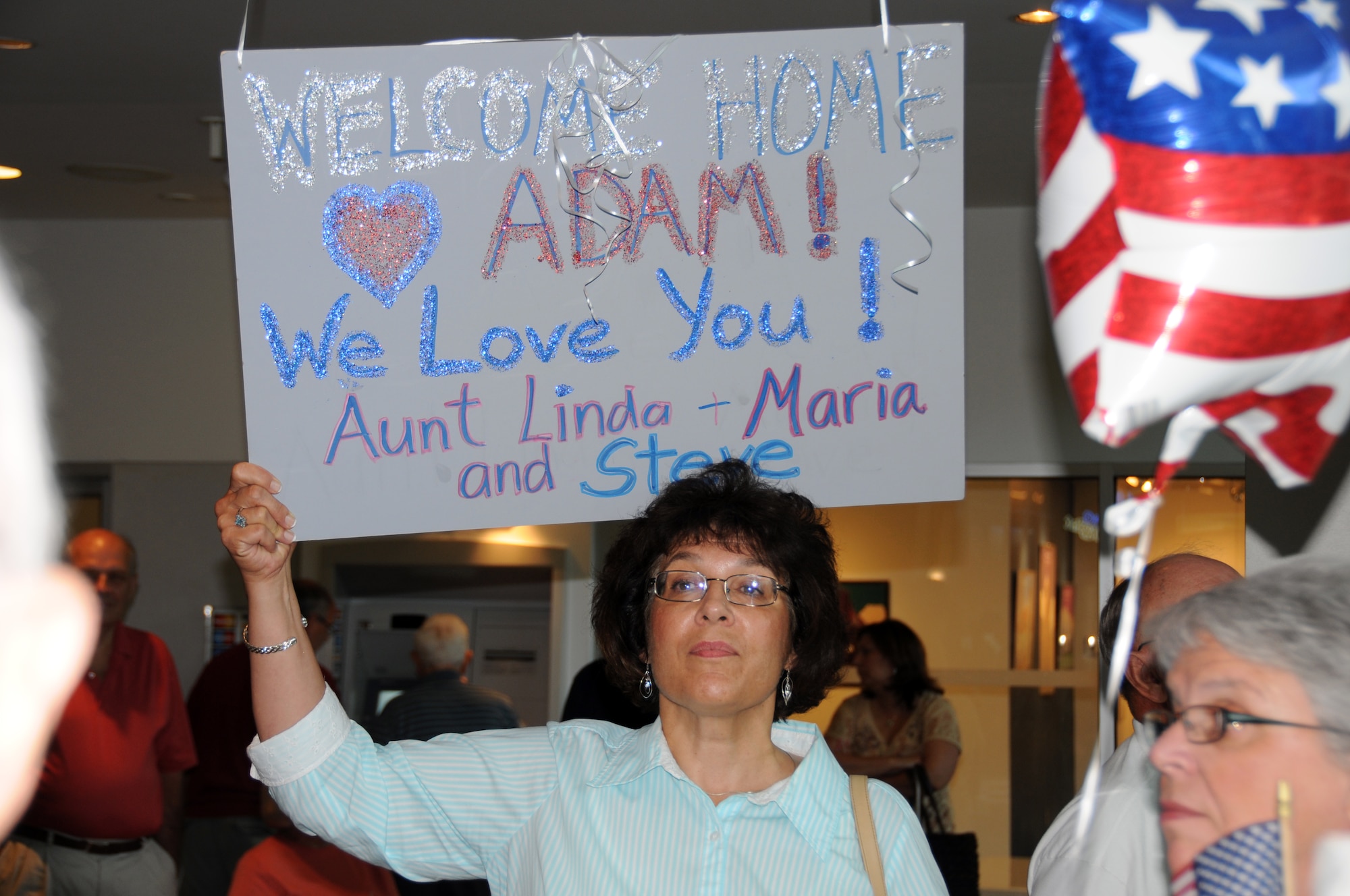 Many family members and friends constructed signs welcoming home their loved ones.  (U.S. Air Force photo/Senior Airman Peter Dean)