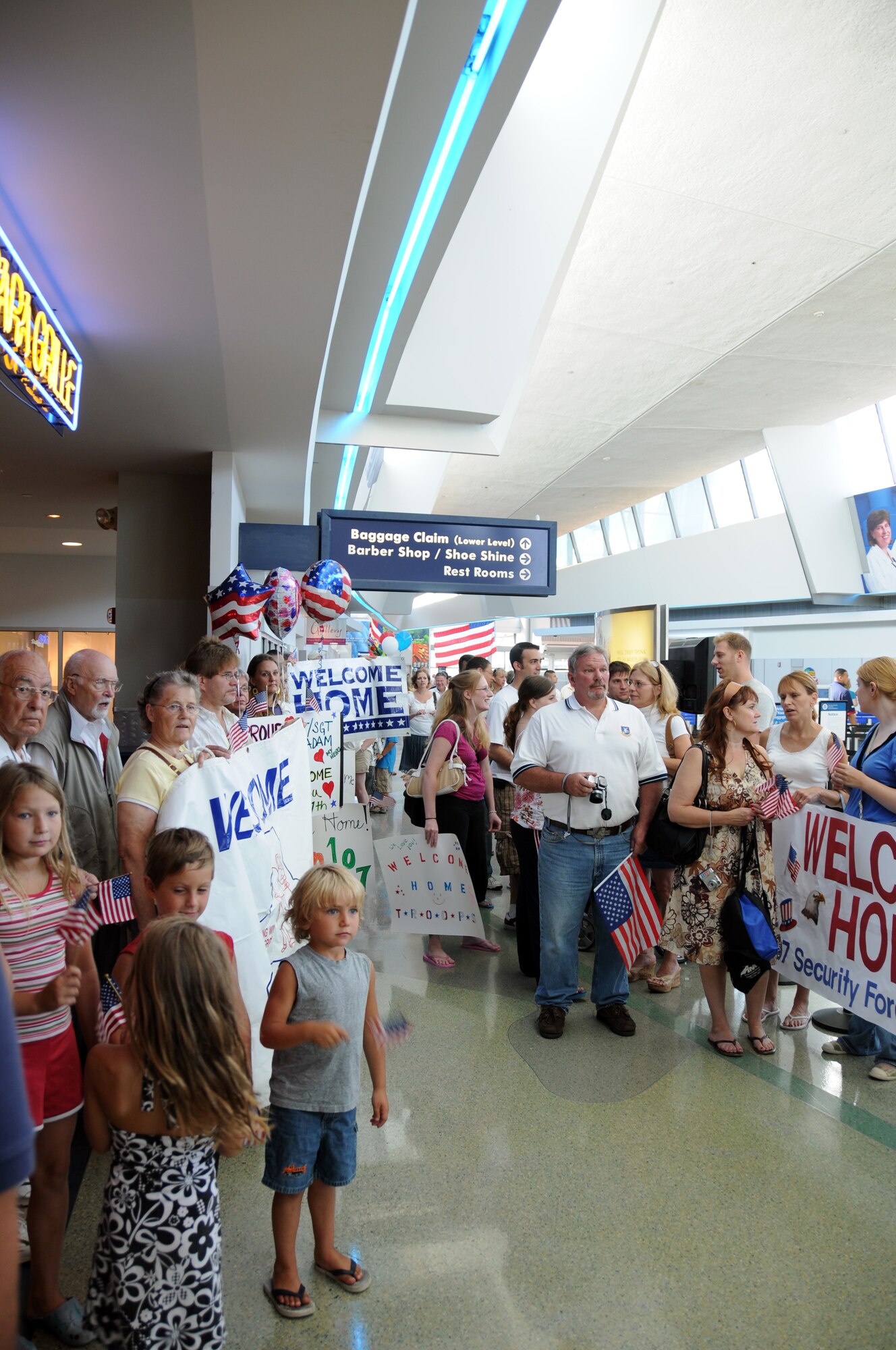 More than 100 friends, families and loved ones eagerly await the return of the 107th AW Security Force Squadron.  (U.S. Air Force photo/Senior Airman Peter Dean)