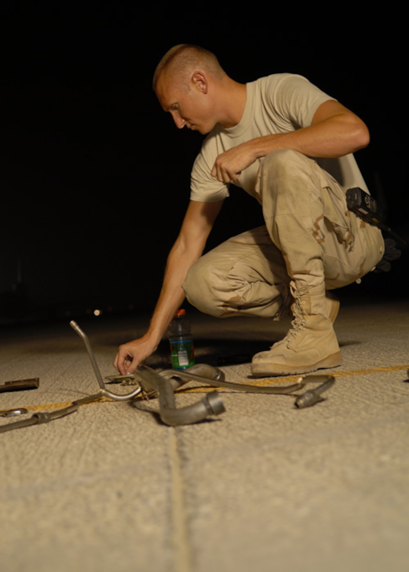 SOUTHWEST ASIA -- The 380th Expeditionary Maintenance Squadron's Staff Sgt. Ryan Pierce, an aero repair specialist, ensures all parts are accounted for after removing a hydraulic package from an E-3 Sentry's engine Sunday. The parts will be inventoried and stored for future use. Accounting for all the parts is a prevention measure toward mitigating foreign object damage to aircraft. (U.S. Air Force Photo/Tech. Sgt. Denise Johnson)(released)