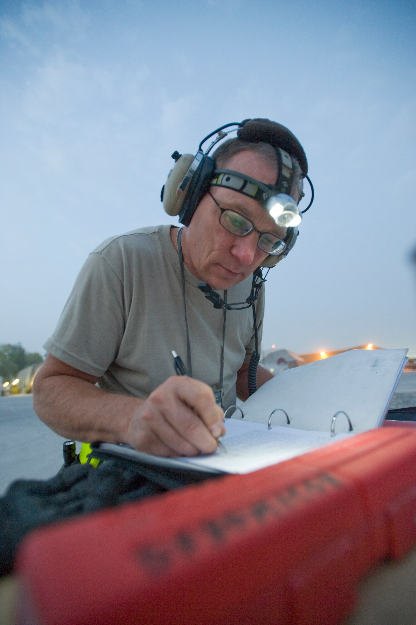 KANDAHAR AIR BASE, Afghanistan --  Master Sgt. William St. Clair updates maintenance records on an HH-60 Pave Hawk before a flight at Kandahar Air Field, Afghanistan Aug. 15. Sergeant St. Clair is a crew chief on the Pave Hawk and has more than three decades of experience in working on Air Force helicopters. The aircraft, as well as the crews  who fly and maintain it are assigned to the 305th Expeditionary Rescue Squadron from Davis-Monthan Air Force Base, Ariz. (U.S. Air Force photo by Master Sgt. Keith Brown)
