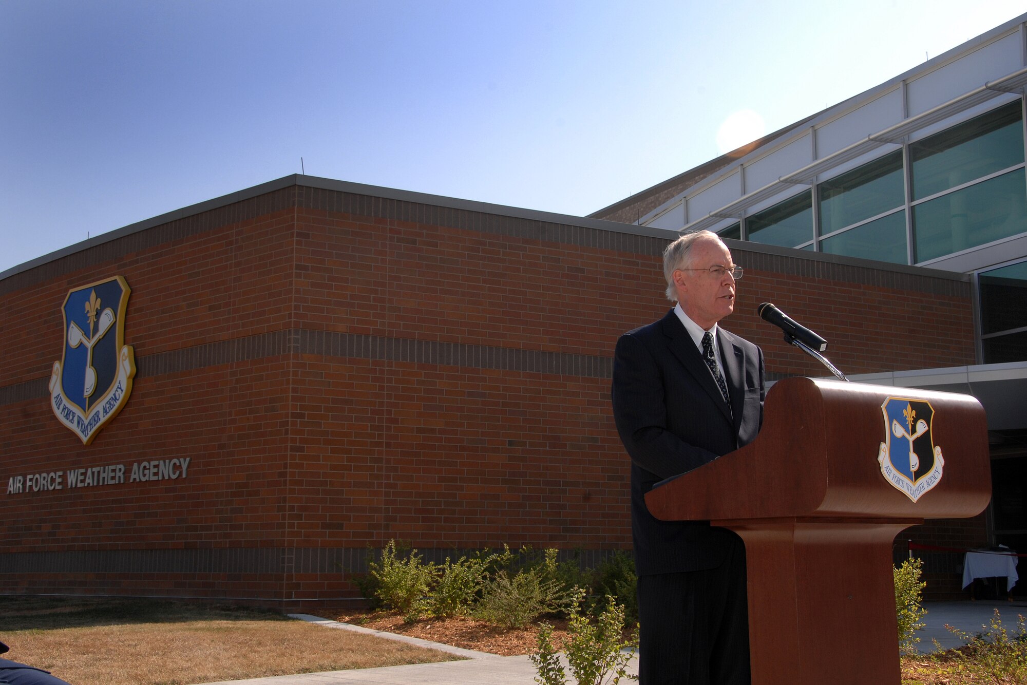 OFFUTT AIR FORCE BASE, Neb. -- Retired Gen. Thomas S. Moorman Jr. addresses attendees and members of the Air Force Weather Agency as they officially dedicated their new $30-million headquarters building during a ribbon cutting ceremony here Aug. 22. The new building was dedicated to Lt. Gen. Thomas S. Moorman and is one of Air Combat Command’s first Leadership in Energy and Environmental Design green rated facilities. (U.S. Air Force Photo by Kevin Schwandt)