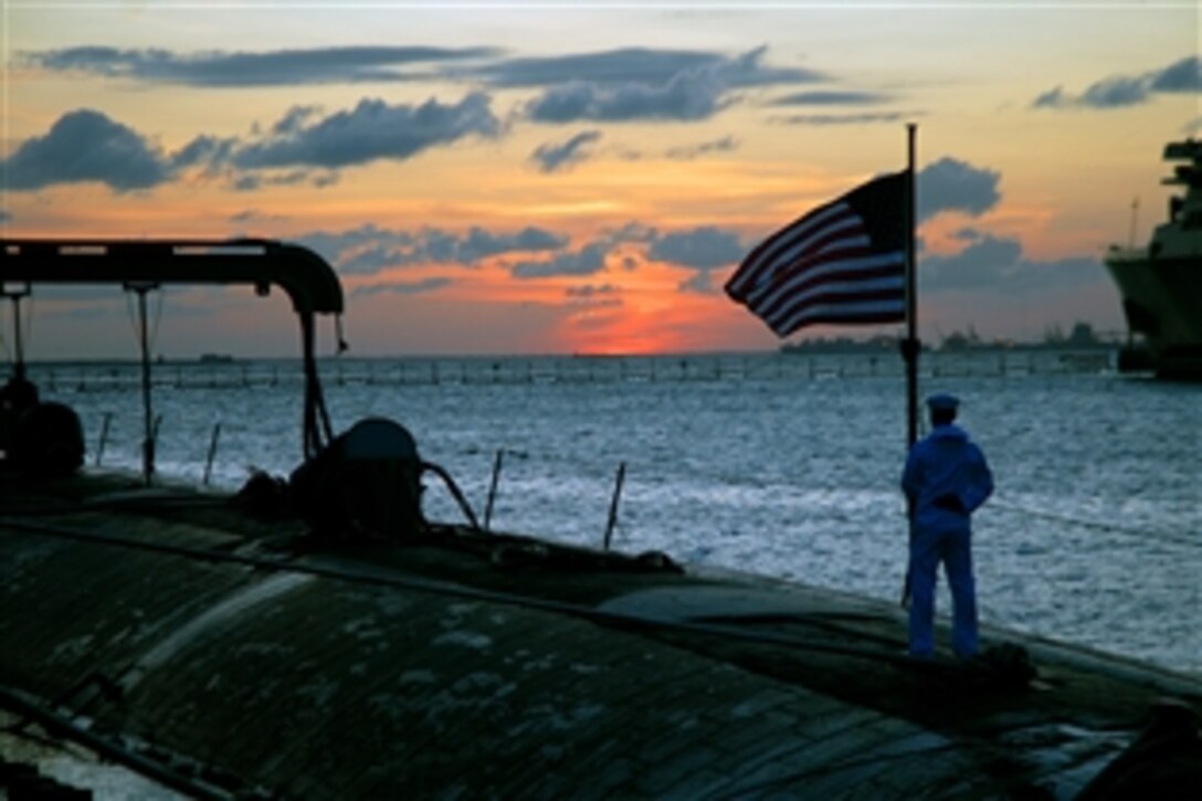 Seaman Zach Vineski prepares to execute evening colors aboard the attack submarine USS Scranton, moored at Naval Station Norfolk's Pier 3. Norfolk,  Va., Aug. 22, 2008. Vineski is a machinist's mate fireman.