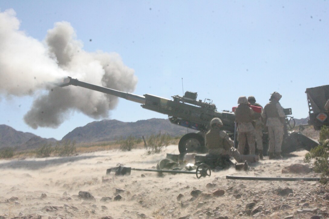 Marines with Lima Battery, 3rd Battalion, 11th Marine Regiment, start off a fire mission with the first of 11 rounds during the battalion’s support of 1st Battalion, 4th Marine Regiment’s pre-deployment training at the Combat Center Aug. 28.  The battalion was the first to conduct fire and maneuver missions in support of another unit in training in almost three years using almost their entire battalion.