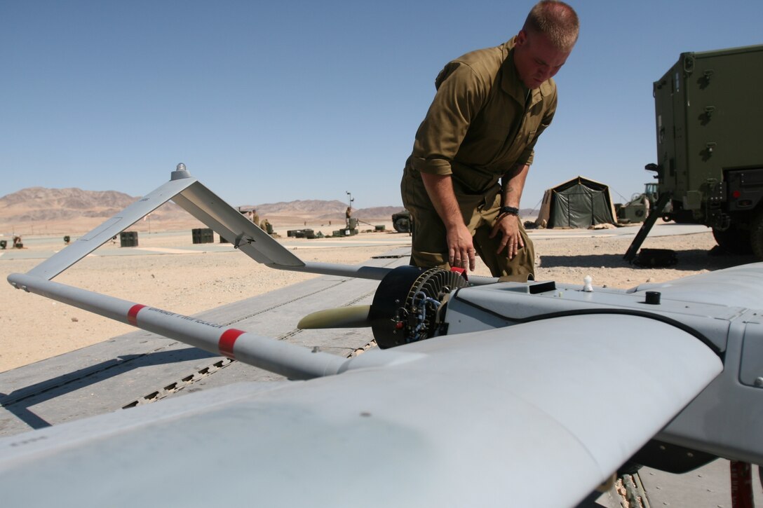 Lance Cpl. Corey D’Angelo, an unmanned aerial vehicle mechanic with VMU-1, goes through post flight mechanical checks on the RQ-7 Shadow UAV Aug. 27 at the Expeditionary Airfield during the squadron’s last training exercise before deploying to Iraq.