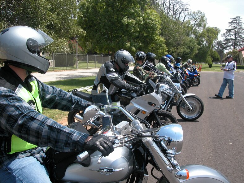 Keith Hobson, Motorcycle Safety Foundation rider coach (right), gives nine budding motorcyclists a few introductory instructions, during the Basic Riders Course (BRC), a beginner’s motorcycle course put on monthly by the 452 AMW Safety Office at March Air Reserve Base. The two-day BRC course, set up in the parking lot behind the March ARB Fitness Center, is designed for riders who have never ridden a motorcycle, according to Master Sgt. Cedric Perry, ground safety specialist. The 18 areas covered by the course included: starting and stopping drills, shifting and stopping, cornering, limited space maneuvers, negotiating curves, and avoiding obstacles. Wing Safety also teaches a one-day Experienced Rider Course. (U.S. Air Force photo by Will Alexander, 452 AMW/PA)