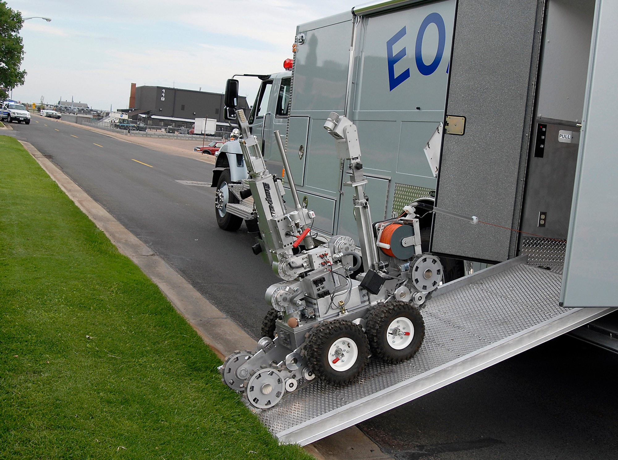 An explosives ordnance disposal robot is deployed to assist in determining if a simulated suspicious package is an explosive device Aug. 20 during Condor Crest 08-05 events at Peterson Air Force Base, Colo. The week-long exercise encompassed several scenarios that challenged Airmen. The scenarios included an intruder on base, severe weather inflicted damage on the base and simulated aircraft accidents. (U.S. Air Force photo/Roberta McDonald)