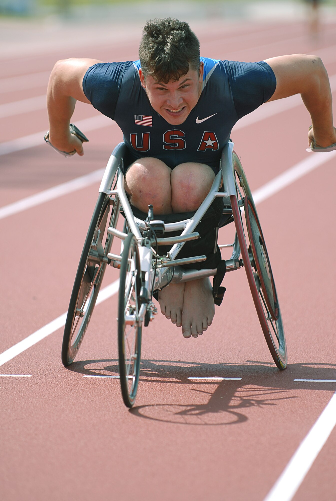 Wheelchair racer Josh Roberts of Morris, Ala., trains for sprint races Aug. 26 at Ryukyu Middle School on Kadena Air Base, Japan.  More than 100 athletes and support staff from the U.S. Paralympics track and field and swim teams arrived on Kadena AB Aug. 24 to live and train for the next ten days in preparation for the 2008 Paralympic Games being held in Beijing, China, Sept. 6. (U.S. Air Force photo/Airman First Class Aaron Johnson)