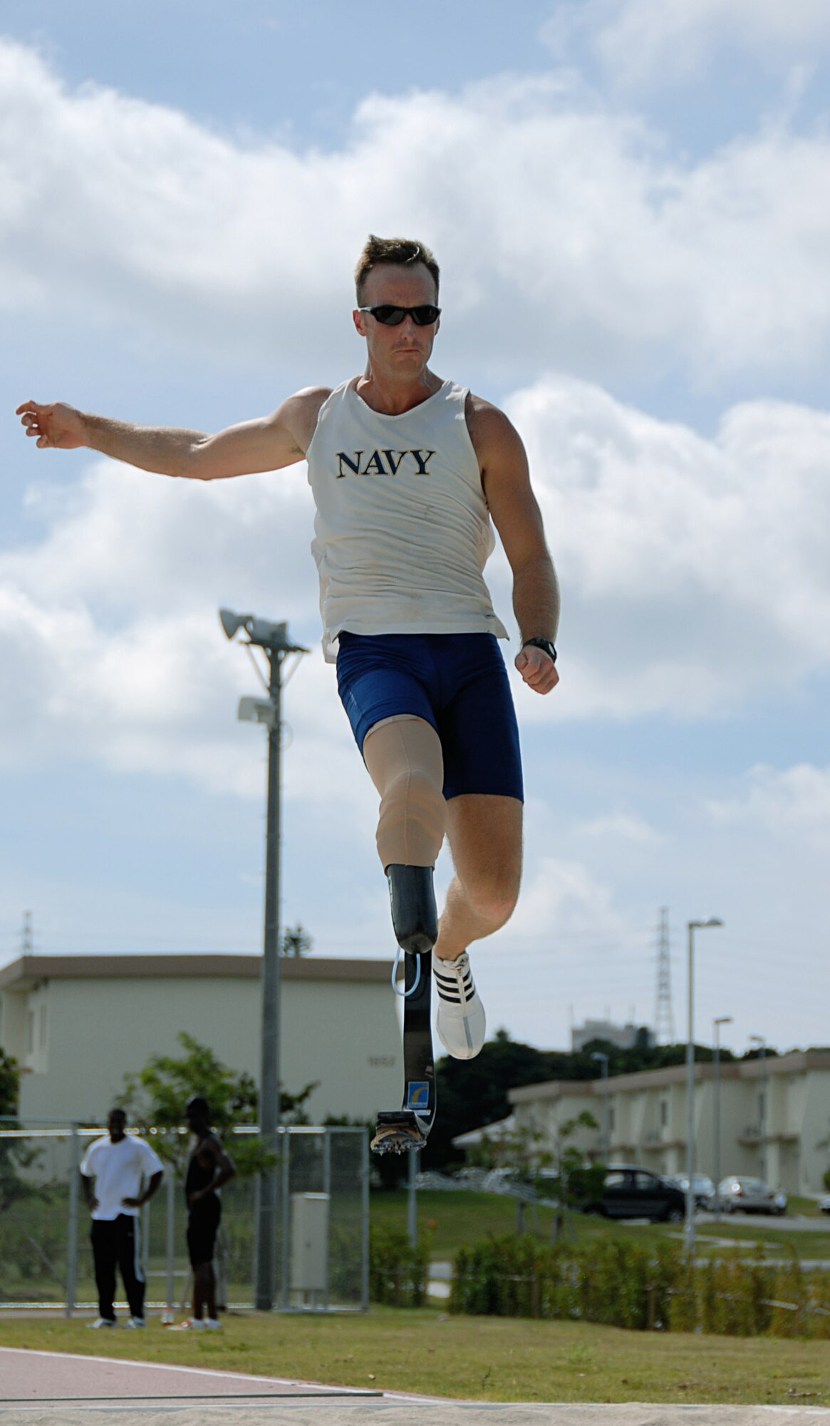 Navy Petty Officer Casey Tibbs of San Diego, Calif., practices the long jump during pentathlon training Aug. 26 at Ryukyu Middle School on Kadena Air Base, Japan.  More than 100 athletes and support staff from the U.S. Paralympics track and field and swim teams arrived on Kadena AB Aug. 24 to live and train for the next ten days in preparation for the 2008 Paralympic Games being held in Beijing, China, Sept. 6. (U.S. Air Force photo/Airman First Class Aaron Johnson)