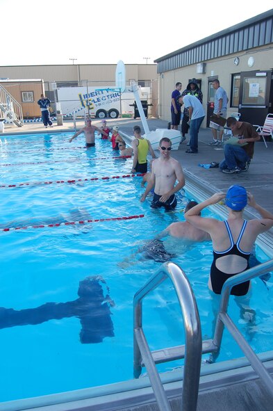 Swimmers prepare for the first heat of the competition during a triathlon held here Aug. 23. More than 50 people came to participate in the event. Athletes could compete in one of four areas; individual, team, mini triathlon and mini triathlon team. The results of the event are as follows:
Individual: Kristina Smith with a time of 1:06:28; James Tanner 1:06:29; Robert Grainger 1:09:23
Team: 10 penny trio 1:13:28; Fighting Ostriches 1:25:27; Rainbow 7 1:25:58
Mini Tri: Tyler Gandolfi 28:42; Melanie Hall 29:04; Lewis Thoenes 32:15
Mini Tri Team: Kingfisher Trio 25:15
(U.S. Air Force photo/Senior Airman Emerald Ralston)