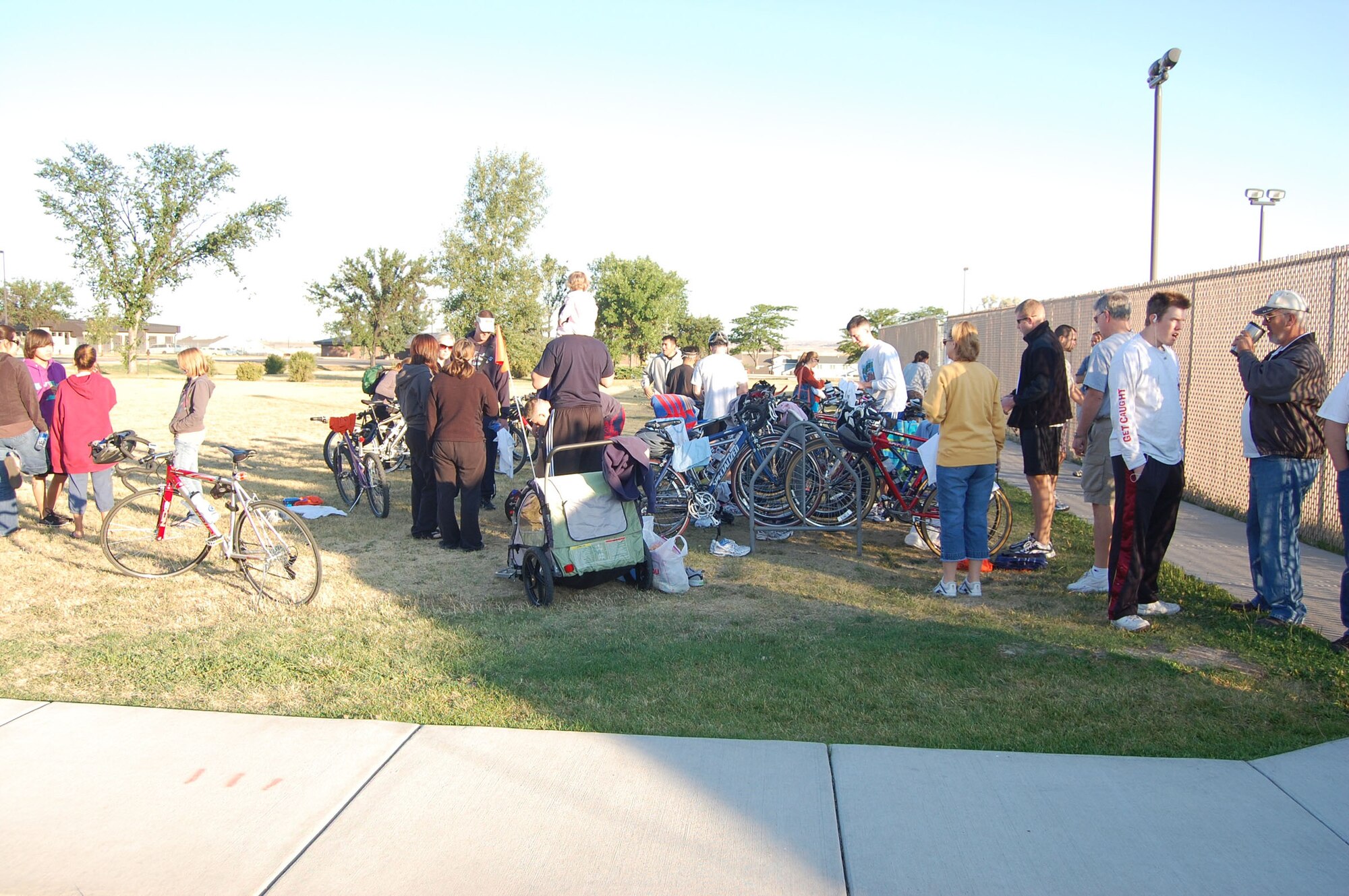 Athletes situate their bikes outside of the base pool prior to a triathlon that took place Aug. 23. The Sports and Fitness Center held the triathlon to give members of Team Malmstrom an opportunity to try it. More than 50 people came out to participate in the event. (U.S. Air Force photo/Senior Airman Emerald Ralston)