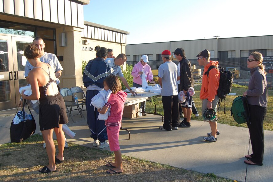 Athletes line up outside the base pool to register for a triathlon that was held on Malmstrom Aug. 23. More than 50 people participated in the event held by the Sports and Fitness Center. (U.S. Air Force photo/Senior Airman Emerald Ralston)