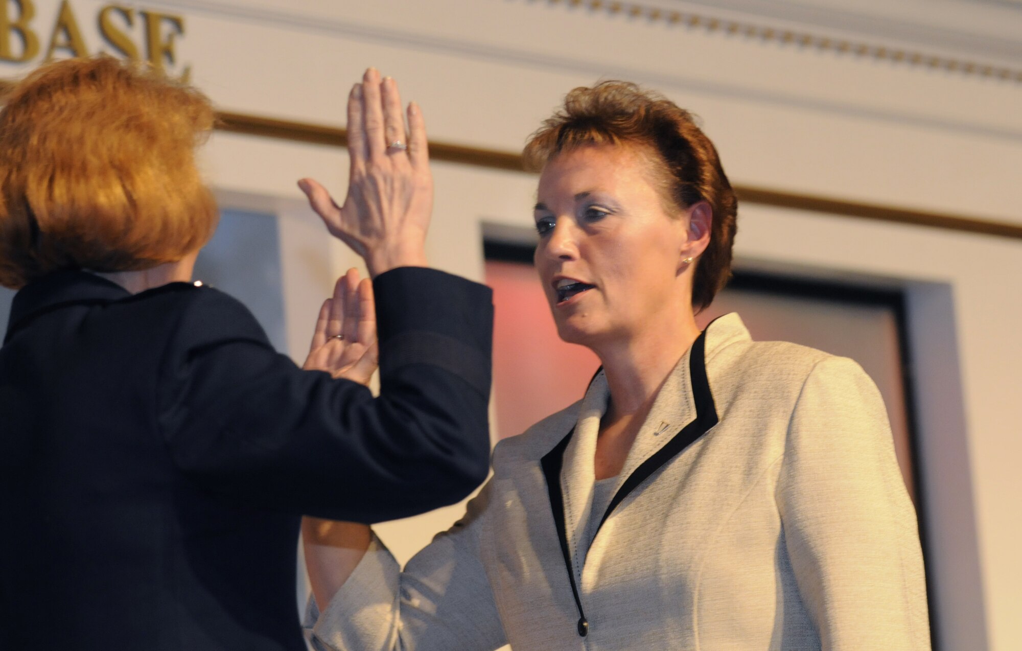 Brenda Romine, WR/ALC executive director takes an oath of office administered by Maj. Gen. Polly A. Peyer, center commander, during the 542nd Combat Sustainment Wing Relinquishment of Leadership and Promotion Recognition Ceremony Aug. 27 at the Museum of Aviation. U. S. Air Force photo by Sue Sapp
