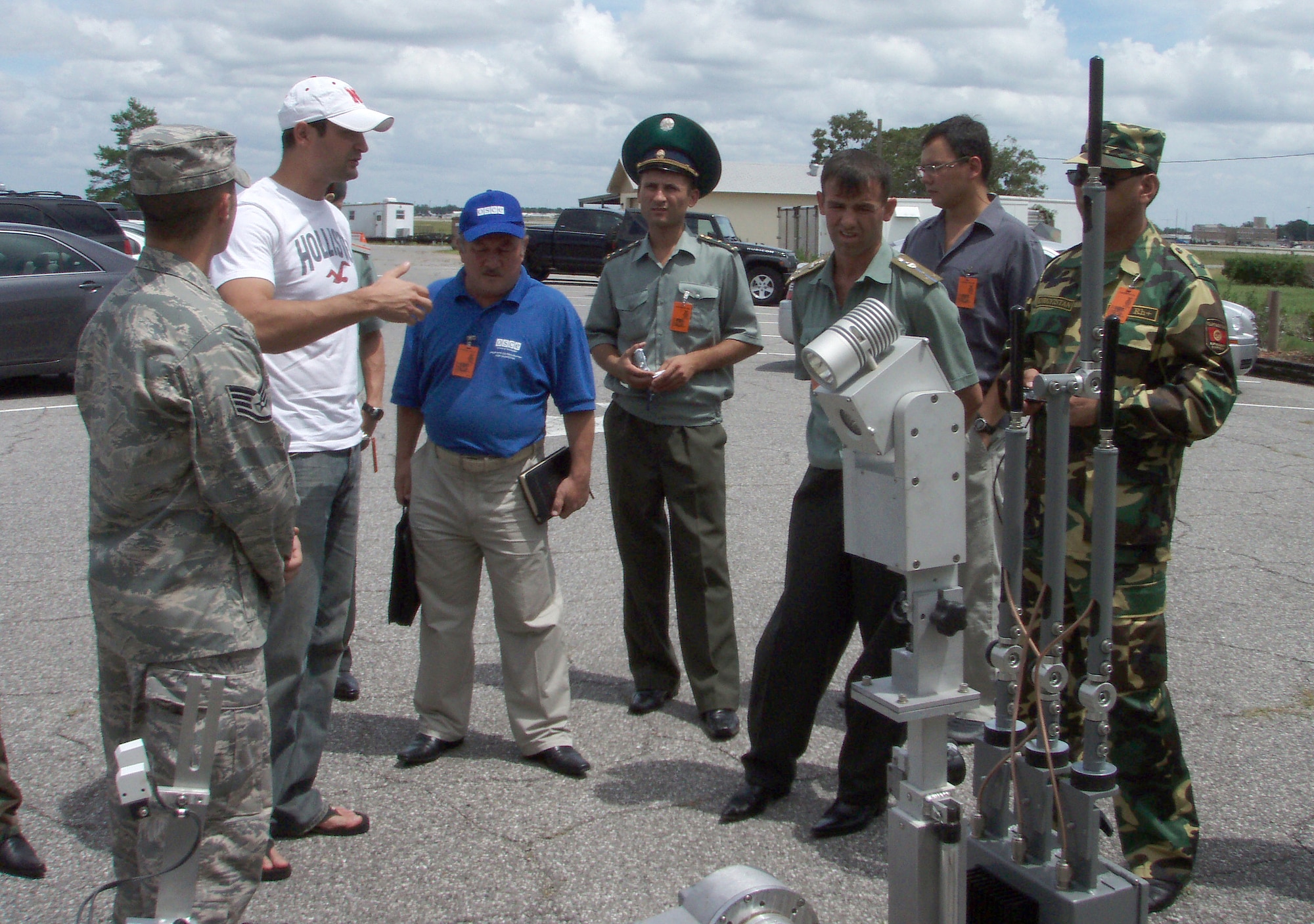 EGLIN AIR FORCE BASE, Fla. -- Staff Sgt. Carlos Sanchez, left, 96th Civil Engineer Squadron explosive ordnance disposal technigican, demonstrates an andros robot's capabilities to 11 foreign officers from Kyrgyzstan and Tajikistan Aug. 21. The intent of the visit was to gather general information about EOD capabilities which will be used to establish training and equipment requirements for their respective countries.  The EOD flight also displayed and demonstrated emergency response equipment. (Courtesy photo)