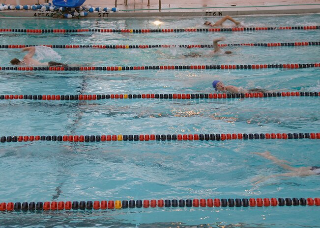 Triathlon contestants swim the 450 meters portion of the triathlon on Charleston AFB Aug. 23. More than 60 participants also biked 14,500 meters and ran 5,000 meters. The fitness center held the fifth annual triathlon to test people's fitness and allow a healthy extracurricular activity. (U.S. Air Force photo/Airman 1st Class Katie Gieratz)