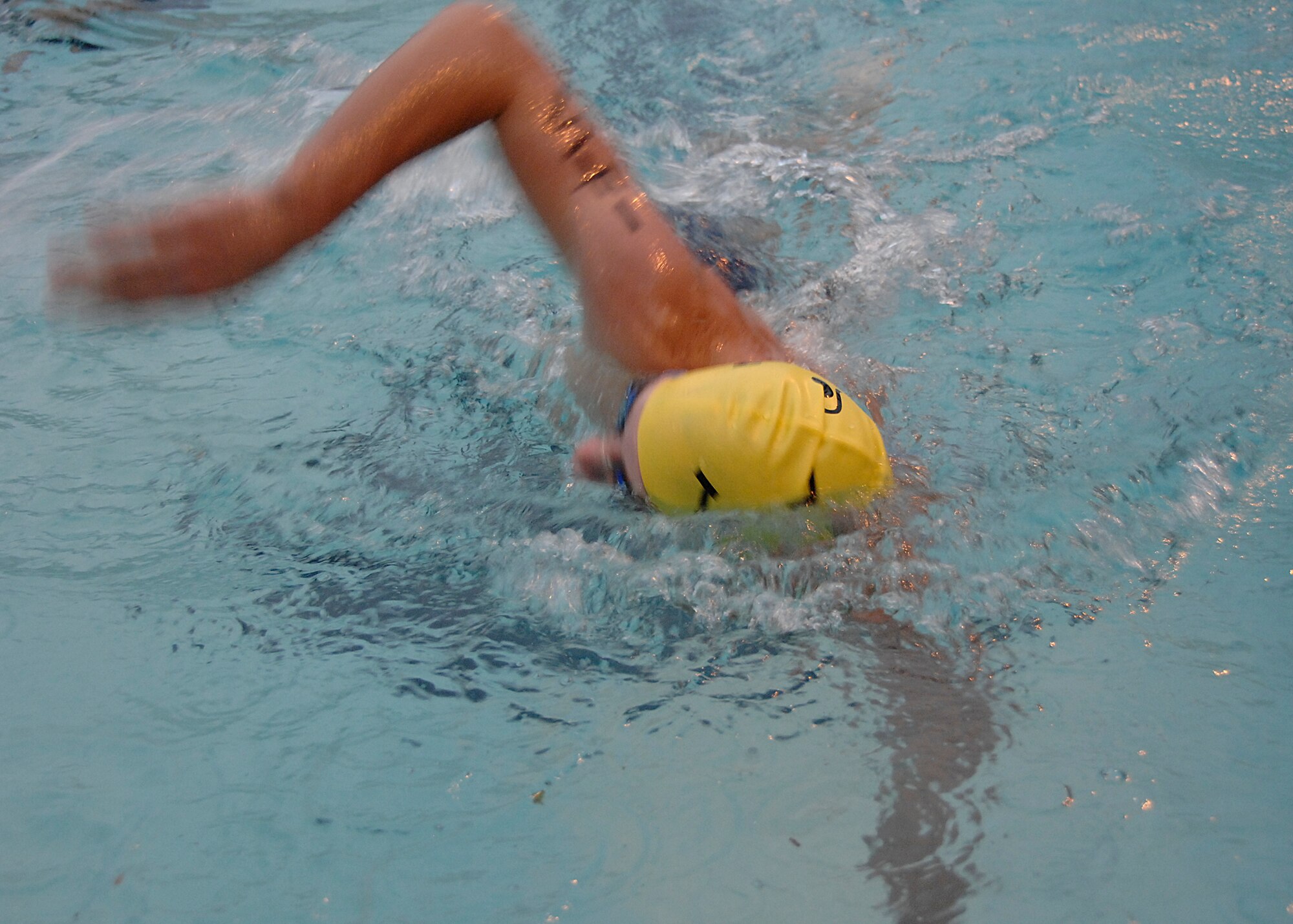 DJ VanMaanen swims the 450 meter portion of the triathlon on Charleston AFB Aug. 23. Besides swimming DJ also biked 14,500 meters and ran 5,000 meters.The fitness center held the fifth annual triathlon to test people's fitness and allow a healthy extracurricular activity. DJ is the 15-year-old son of Lt. Col. Karen Wade. (U.S. Air Force photo/Airman 1st Class Katie Gieratz))